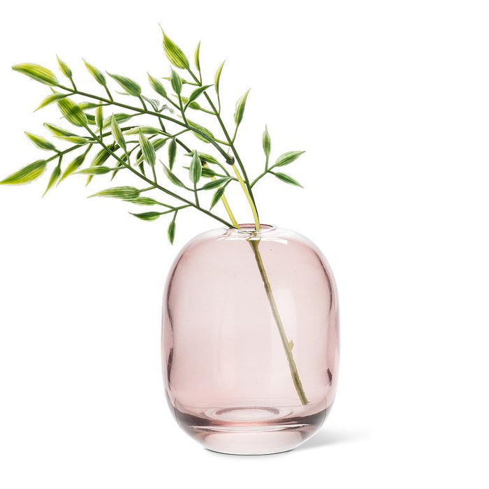 Abbott dark rose glass bud vase styled with decorative greenery stems