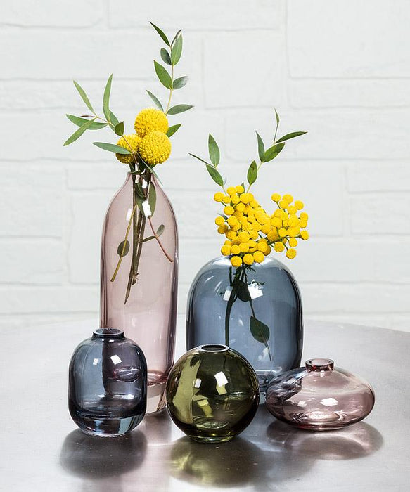 Abbott decorative glass bud vase collection displayed with fresh flowers and greenery