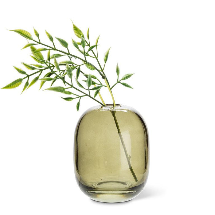 Abbott moss green glass bud vase styled with decorative greenery stems