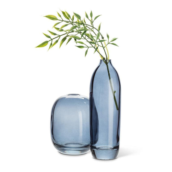Abbott dark blue glass bud vase displayed alongside a matching decorative vase
