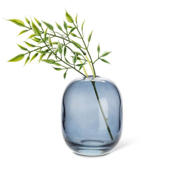 Abbott dark blue glass bud vase styled with decorative greenery stems