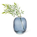 Abbott dark blue glass bud vase styled with decorative greenery stems