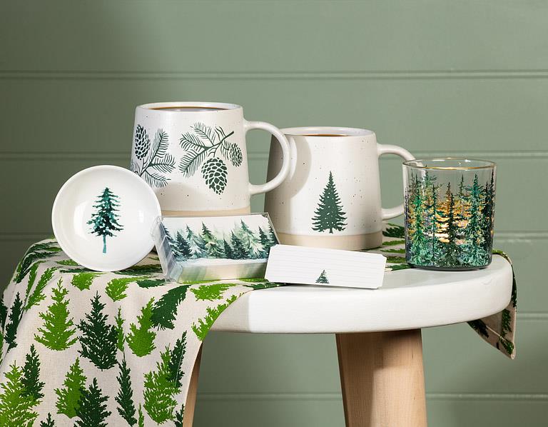 Abbott pinecone stoneware mugs displayed with evergreen trees and seasonal décor