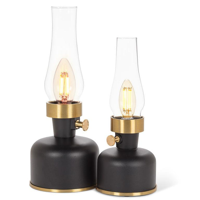 Two small black lantern LED lamps with glass chimneys and warm Edison bulbs