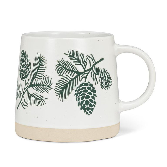 Front view of Abbott 14 oz wide-base stoneware mug with green pinecones and evergreen branches