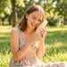 Woman enjoying the Asobu Capybara Bestie Bottle outdoors