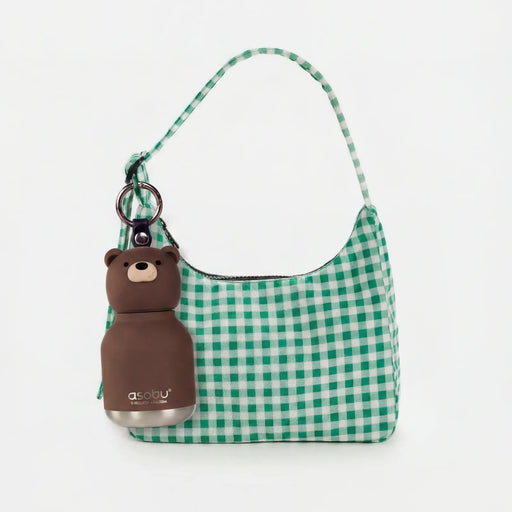 Asobu Mini Besties Bear bottle attached to a handbag with built-in key ring