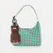 Asobu Mini Besties Bear bottle attached to a handbag with built-in key ring