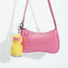 Asobu Mini Duck Besties bottle attached to a pink handbag with built-in key ring