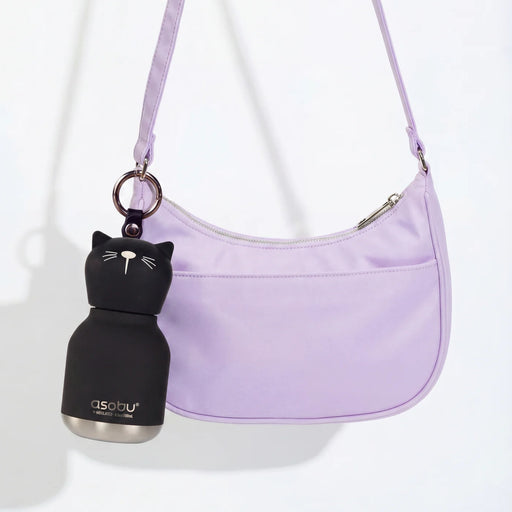 Asobu Mini Kitty Bestie water bottle attached to a handbag with the built-in key ring