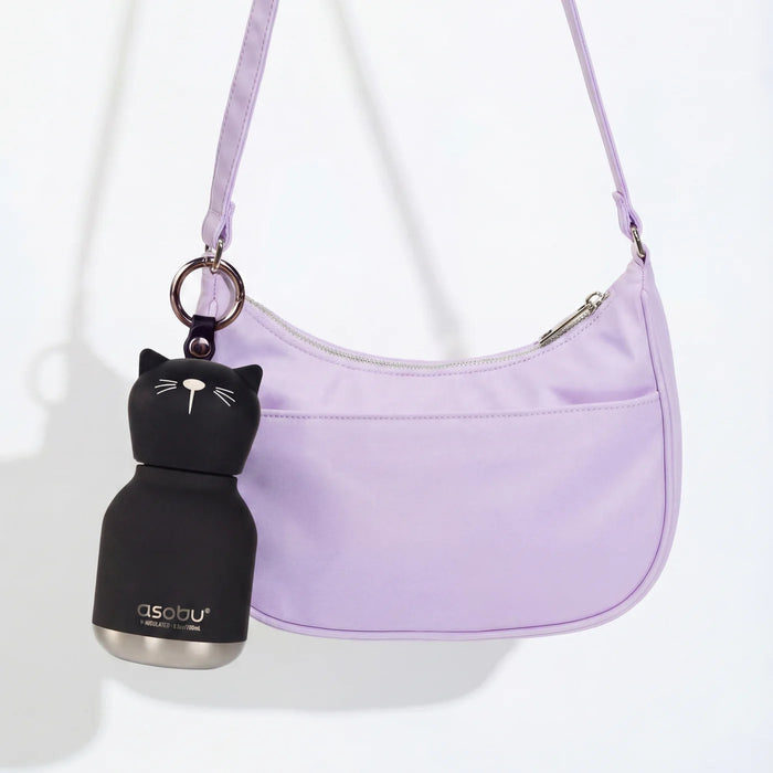 Asobu Mini Kitty Bestie water bottle attached to a handbag with the built-in key ring