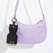 Asobu Mini Kitty Bestie water bottle attached to a handbag with the built-in key ring
