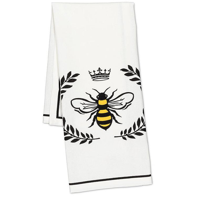 Close up of bee design on cotton kitchen towel with black and yellow print