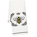 Close up of bee design on cotton kitchen towel with black and yellow print