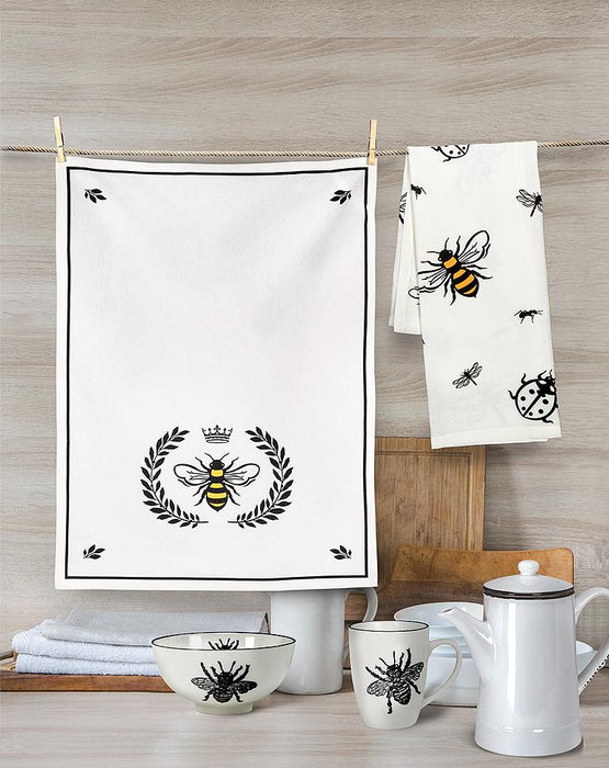 Bee crest kitchen towel set displayed in modern kitchen with wooden board and white kitchen accessories