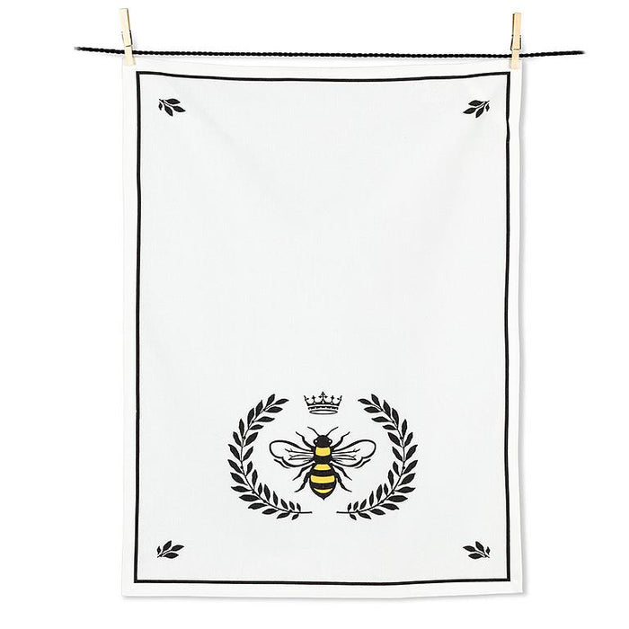 Bee crest cotton kitchen towel with black border and yellow bee design hanging on display