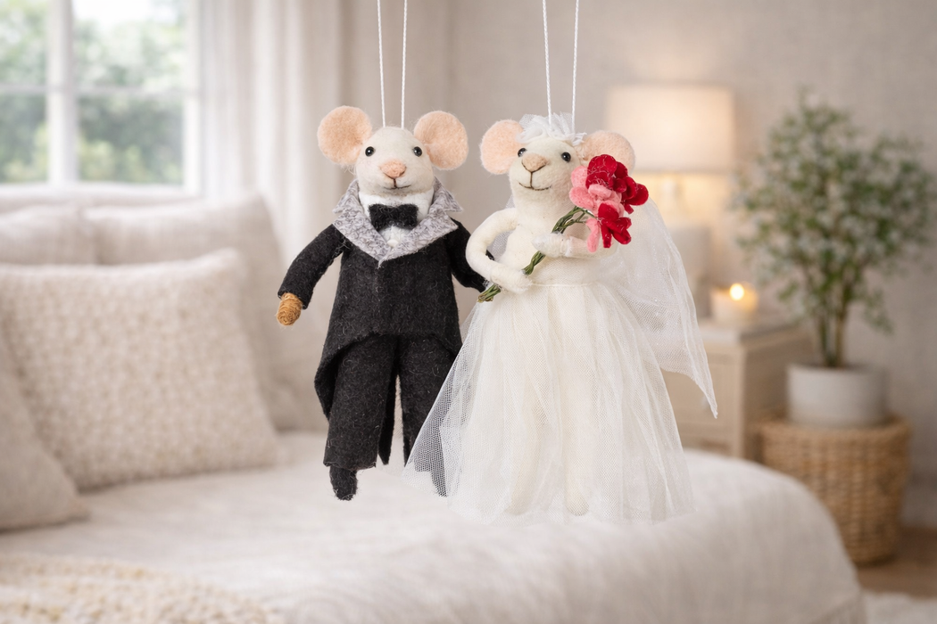 Bride and groom mouse ornaments displayed together romantic home decor