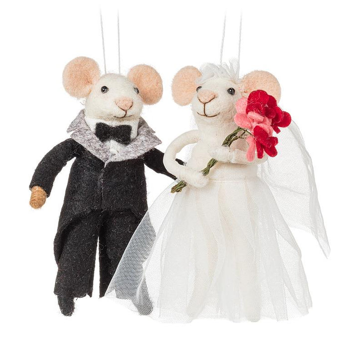 Bride and groom mouse ornament set displayed together wedding decor