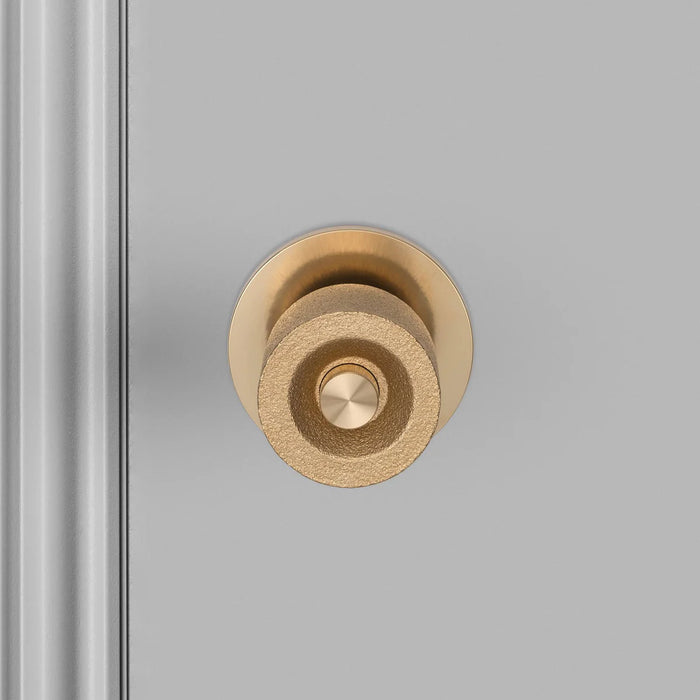 Front detail view of Buster + Punch Cast Door Knob Set in Brass finish