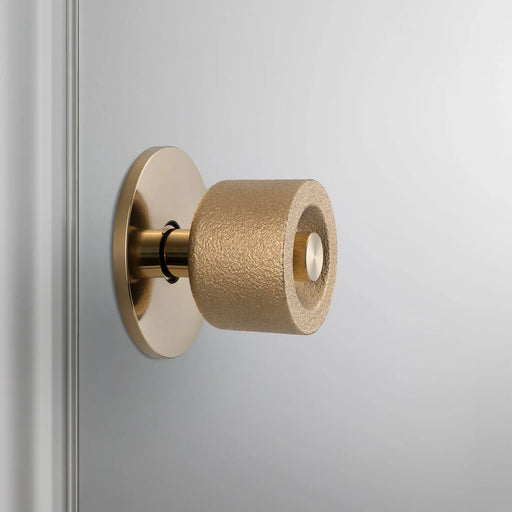 Side profile of Buster + Punch Cast Door Knob Set in Brass finish
