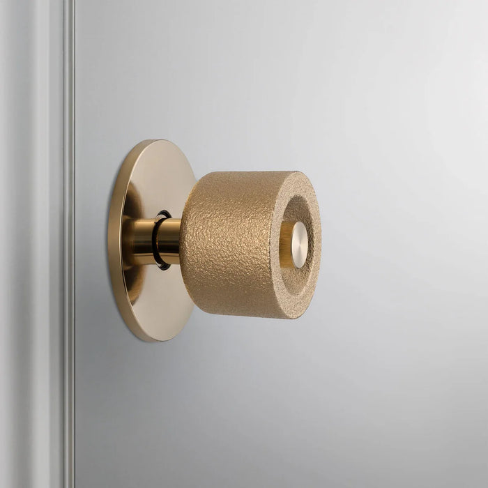 Side profile of Buster + Punch Cast Door Knob Set in Brass finish