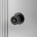 Angled view of Buster + Punch Cast Door Knob Set in Smoked Bronze finish