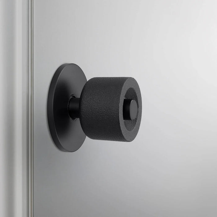 Detailed close-up of Buster + Punch Cast Door Knob Set in Smoked Bronze finish