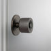Side view of Buster + Punch Cast Door Knob Set in Smoked Bronze finish