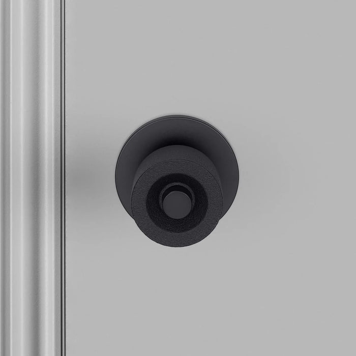 Close-up front detail of Buster + Punch Cast Door Knob Set in Welders Black finish