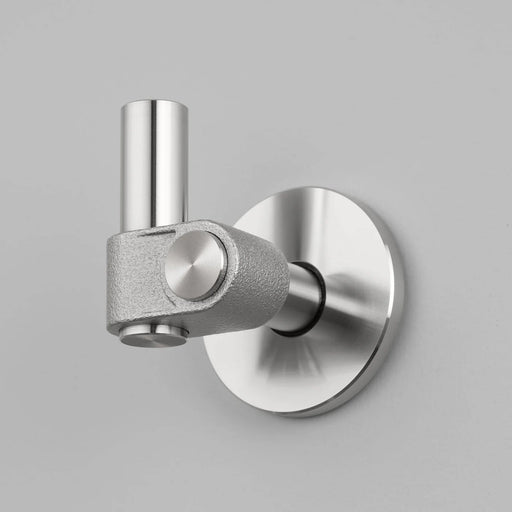Buster + Punch Cast hook in steel finish mounted on wall