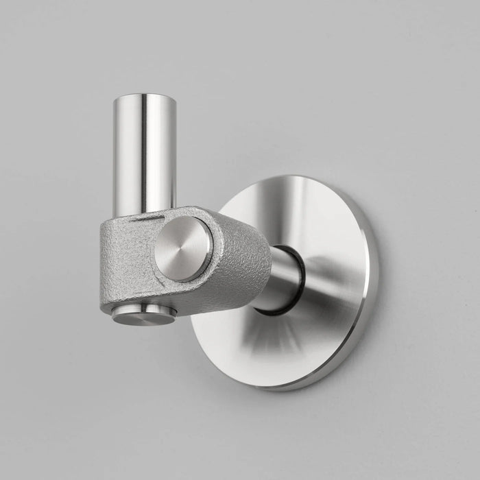 Buster + Punch Cast hook in steel finish mounted on wall