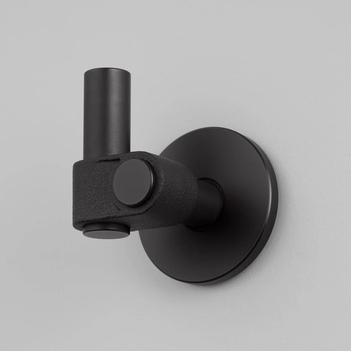 Angled close-up of Buster + Punch Cast hook in Welders Black finish