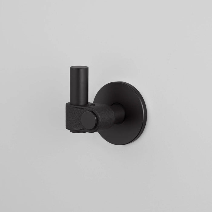 Buster + Punch Cast hook in Welders Black finish mounted on wall