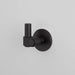 Buster + Punch Cast hook in Welders Black finish mounted on wall