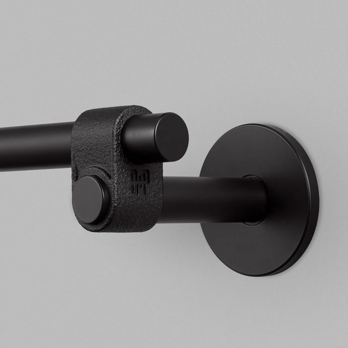 Close-up detail of Buster + Punch Cast medium towel rail in welders black finish