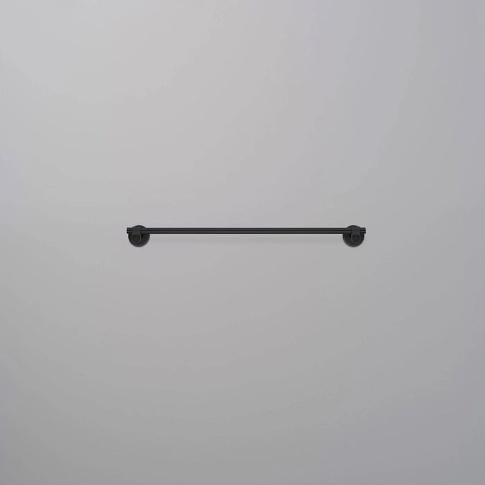 Front view of Buster + Punch Cast medium towel rail in welders black finish