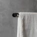 Buster + Punch Cast medium towel rail in welders black finish with white towel