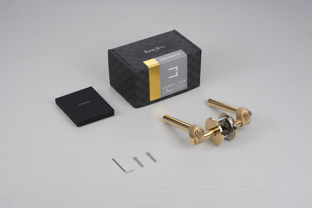 Buster + Punch Cast Passage Door Handle Set in Brass with packaging and installation hardware