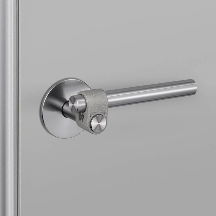 Detailed close-up of Buster + Punch Cast Passage Door Handle Set in Steel finish