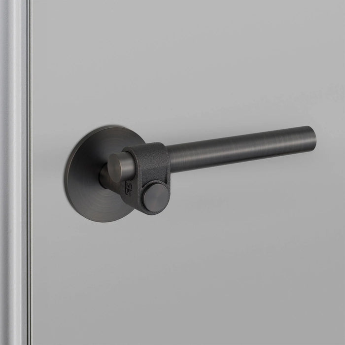 Angled view of Buster + Punch Cast Passage Door Handle Set in Welders Black finish