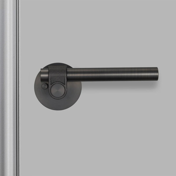 Detailed close-up of Buster + Punch Cast Privacy Door Handle Set in Smoked Bronze finish