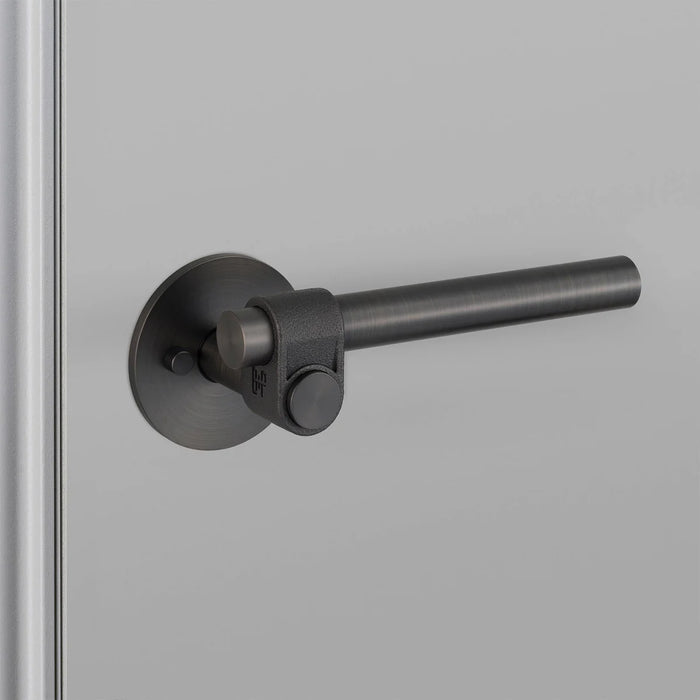 Side angle of Buster + Punch Cast Privacy Door Handle Set in Smoked Bronze finish