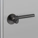 Side angle of Buster + Punch Cast Privacy Door Handle Set in Smoked Bronze finish