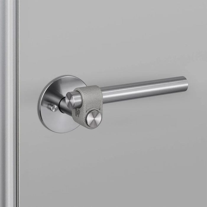 Angled view of Buster + Punch Cast Privacy Door Handle Set in Steel finish