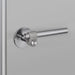 Angled view of Buster + Punch Cast Privacy Door Handle Set in Steel finish