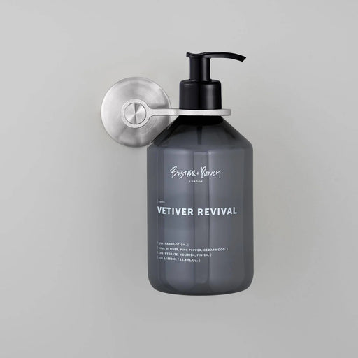 Buster + Punch Cast single dispenser soap holder in steel finish holding soap dispenser bottle