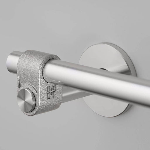 Close-up detail of Buster + Punch Cast toilet roll holder showing textured cast knuckle in steel finish