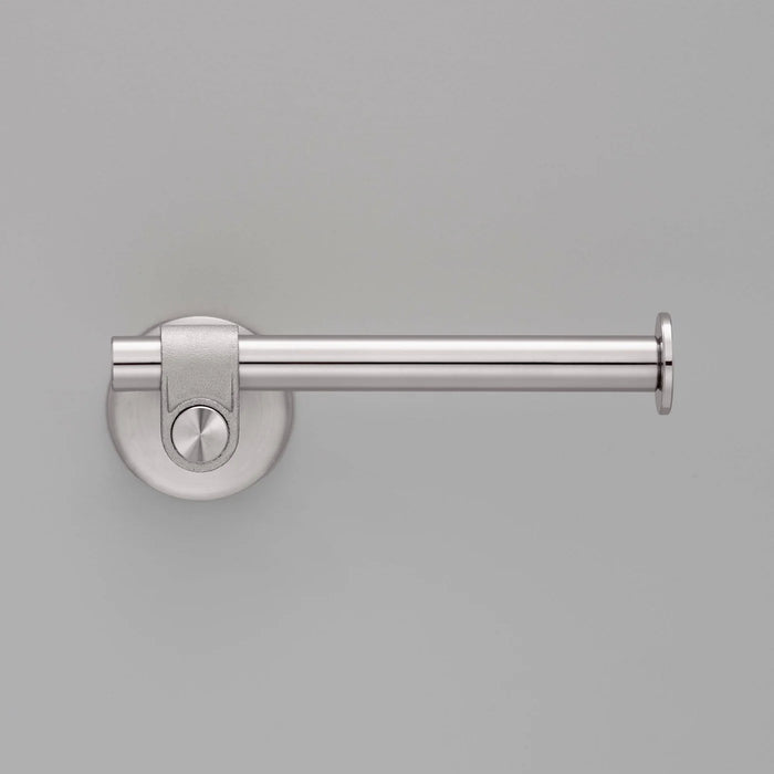 Front view of Buster + Punch Cast toilet roll holder in steel finish