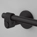 Close-up detail of Buster + Punch Cast toilet roll holder in welders black finish