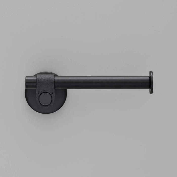 Side profile of Buster + Punch Cast toilet roll holder in welders black finish